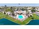 A refreshing community pool and spa area surrounded by palm trees, offering a resort-style experience at 20739 N 106Th Ln, Peoria, AZ 85382