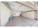 Spacious garage with ample storage cabinets and a work area at 20739 N 106Th Ln, Peoria, AZ 85382
