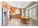 Bright kitchen with stainless steel appliances, ample cabinet space, and an adjacent dining area at 20739 N 106Th Ln, Peoria, AZ 85382