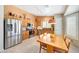 Bright eat-in kitchen with stainless appliances, wood cabinets, and tile flooring at 20739 N 106Th Ln, Peoria, AZ 85382