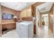 Functional laundry room with a washer, dryer, and storage cabinets at 20739 N 106Th Ln, Peoria, AZ 85382