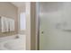 Bathroom featuring a clear glass shower, a tub with tile trim, and natural light at 22333 E Calle De Flores St, Queen Creek, AZ 85142