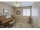 Charming bedroom featuring an upright piano and filled with natural light at 22333 E Calle De Flores St, Queen Creek, AZ 85142