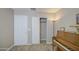 Relaxing bedroom with piano, neutral walls, carpet and closet at 22333 E Calle De Flores St, Queen Creek, AZ 85142