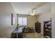 Comfortable room with a ceiling fan, desk area, and ample natural light at 22333 E Calle De Flores St, Queen Creek, AZ 85142