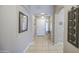 Welcoming home entryway showcasing an arched doorway, neutral paint, and tile flooring at 22333 E Calle De Flores St, Queen Creek, AZ 85142