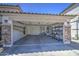 Spacious garage featuring a clean concrete floor and ample storage space at 22333 E Calle De Flores St, Queen Creek, AZ 85142
