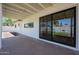 Back patio with a sliding glass door and a well-maintained, neutral-colored exterior at 228 E Del Rio Dr, Tempe, AZ 85282