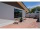 Brick patio with chairs and white brick wall at 228 E Del Rio Dr, Tempe, AZ 85282