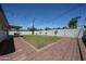 Spacious backyard featuring gravel, grass, string lights, and block walls, ideal for outdoor living at 228 E Del Rio Dr, Tempe, AZ 85282