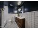 Modern bathroom featuring double vanity, stylish fixtures, and designer tile accents at 228 E Del Rio Dr, Tempe, AZ 85282