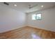 Bedroom with hardwood floors, a window, and white walls at 228 E Del Rio Dr, Tempe, AZ 85282