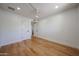 Bright bedroom featuring hardwood floors, recessed lighting, and a ceiling fan at 228 E Del Rio Dr, Tempe, AZ 85282