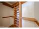 Spacious closet with custom wood shelving and hanging space at 228 E Del Rio Dr, Tempe, AZ 85282