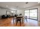 Cozy dining area with a round table, chairs, and easy access to both the living room and outdoor patio at 228 E Del Rio Dr, Tempe, AZ 85282
