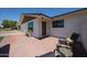 Inviting front exterior featuring a brick-paved patio and well-maintained landscaping at 228 E Del Rio Dr, Tempe, AZ 85282
