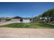 Well-maintained single-story home with fresh paint, a tidy lawn, and an attached one car garage at 228 E Del Rio Dr, Tempe, AZ 85282