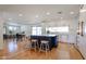 Bright kitchen with a center island, seating, and a view into the adjacent living and dining spaces at 228 E Del Rio Dr, Tempe, AZ 85282