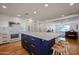 Stylish kitchen island with quartz countertop, custom cabinetry, and stainless steel appliances at 228 E Del Rio Dr, Tempe, AZ 85282