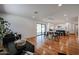 Open-concept living and dining area with hardwood floors and natural light, showcasing a modern kitchen at 228 E Del Rio Dr, Tempe, AZ 85282