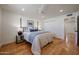 Bright bedroom with light wood floors, a bed, and closet space at 228 E Del Rio Dr, Tempe, AZ 85282