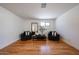 Cozy room with hardwood floors, neutral walls, and two chairs with a modern coffee table at 228 E Del Rio Dr, Tempe, AZ 85282