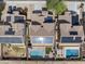 Beautiful aerial view of homes with solar panels and private pools, perfect for outdoor living at 22812 N 123Rd Dr, Sun City West, AZ 85375