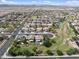 Aerial view of the neighborhood with well-manicured lawns, a community golf course, and desert views at 22812 N 123Rd Dr, Sun City West, AZ 85375