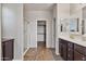 Open concept bath with glass shower and walk in closet at 22812 N 123Rd Dr, Sun City West, AZ 85375
