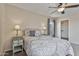 Comfortable bedroom features neutral tones, soft lighting, carpet, and a ceiling fan at 22812 N 123Rd Dr, Sun City West, AZ 85375