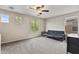 Neutral bedroom with a ceiling fan, and multiple windows for natural light at 22812 N 123Rd Dr, Sun City West, AZ 85375