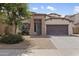 Charming single-Gathering home featuring a well-maintained front yard, two car garage, and inviting entry at 22812 N 123Rd Dr, Sun City West, AZ 85375