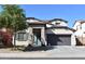 Charming two-story home featuring a well-manicured lawn and a welcoming covered entryway at 22812 N 123Rd Dr, Sun City West, AZ 85375