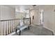 Hallway featuring neutral walls, seating area, and views into the other rooms at 22812 N 123Rd Dr, Sun City West, AZ 85375