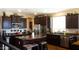 The kitchen features dark cabinets, stainless steel appliances, and a granite-topped island at 22812 N 123Rd Dr, Sun City West, AZ 85375