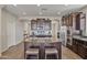 Spacious kitchen island with granite countertop and seating in a modern kitchen at 22812 N 123Rd Dr, Sun City West, AZ 85375