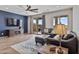 Cozy living room with stylish furniture, wood floors, and a view of the outdoor patio at 22812 N 123Rd Dr, Sun City West, AZ 85375