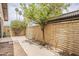 Cozy backyard featuring a block wall, pathway, mature trees, and space for landscaping at 2515 S Maple Ave # 103, Tempe, AZ 85282