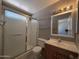 Bathroom featuring a glass-enclosed shower, vanity with sink, and neutral decor at 2515 S Maple Ave # 103, Tempe, AZ 85282