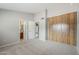 Spacious bedroom with neutral colors and large closet with wood sliding doors at 2515 S Maple Ave # 103, Tempe, AZ 85282