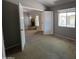 Comfortable bedroom showcasing a brick fireplace in an adjacent room, and soft neutral carpet at 2515 S Maple Ave # 103, Tempe, AZ 85282