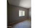 Neutral bedroom featuring plush carpet, a window for natural light, and closet for storage at 2515 S Maple Ave # 103, Tempe, AZ 85282