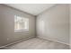 Bedroom with neutral carpet and a large window at 2515 S Maple Ave # 103, Tempe, AZ 85282