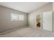 Bright bedroom with a large window and ensuite bathroom at 2515 S Maple Ave # 103, Tempe, AZ 85282