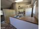 Bright kitchen with updated appliances, an island sink, and ample cabinet space at 2515 S Maple Ave # 103, Tempe, AZ 85282