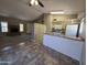 Open kitchen with island and view to living room, showing a functional, eat-in space at 2515 S Maple Ave # 103, Tempe, AZ 85282