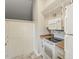 Well-equipped kitchen featuring ample cabinetry, a microwave, and a stove at 2515 S Maple Ave # 103, Tempe, AZ 85282