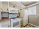 Well-lit kitchen with a stove, microwave, refrigerator and wood countertops at 2515 S Maple Ave # 103, Tempe, AZ 85282