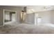 Open-concept living area featuring neutral walls, carpeted floors, and access to other rooms at 2515 S Maple Ave # 103, Tempe, AZ 85282