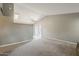 Spacious carpeted living room with vaulted ceiling and sliding glass doors to the exterior at 2515 S Maple Ave # 103, Tempe, AZ 85282
